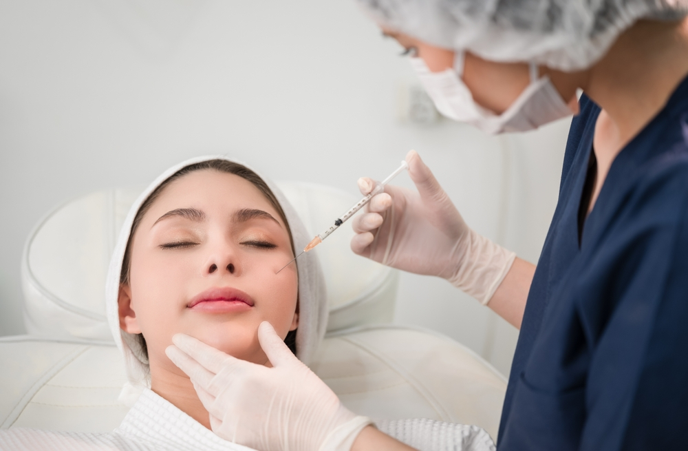 nurse injecting botox on woman's face - U R Royalty - Cypress, Texas