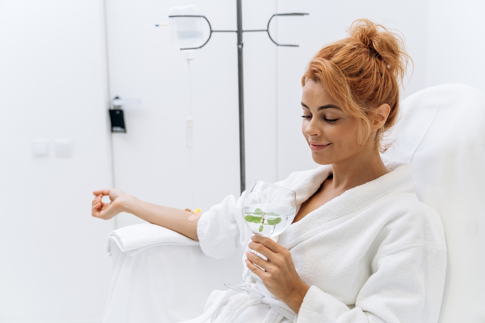 woman relaxing while having IV drip - U R Royalty Med Spa - Cypress, Texas